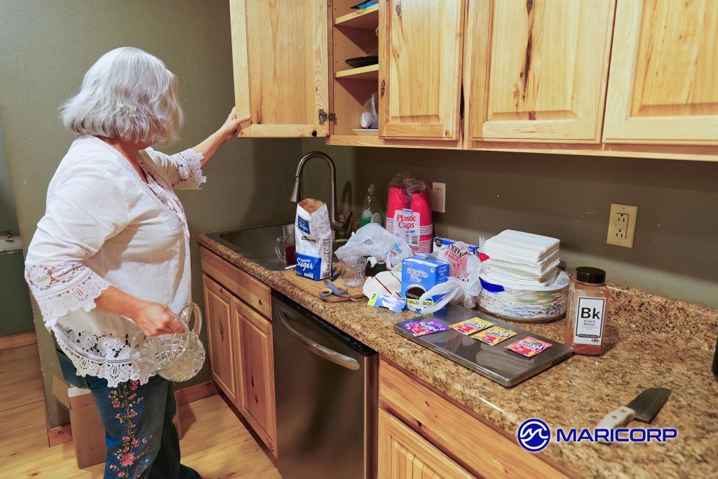 Melanie is mixing up batches of Kool-Aid for National Kool-Aid day