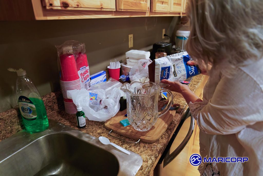 Melanie is mixing up batches of Kool-Aid for National Kool-Aid day