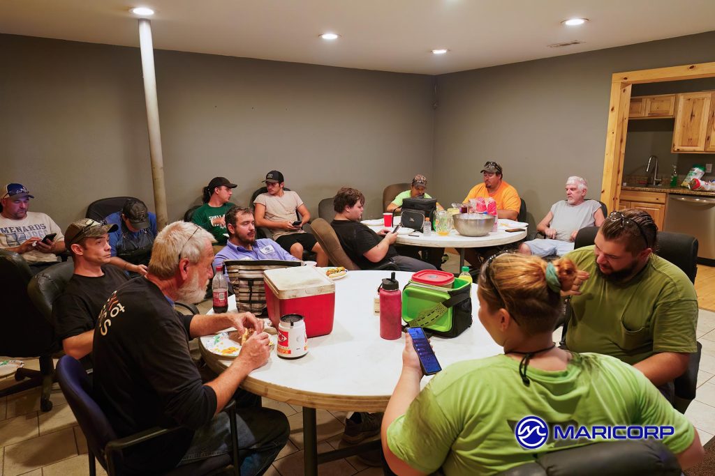 Employees enjoying brats and Kool-Aid